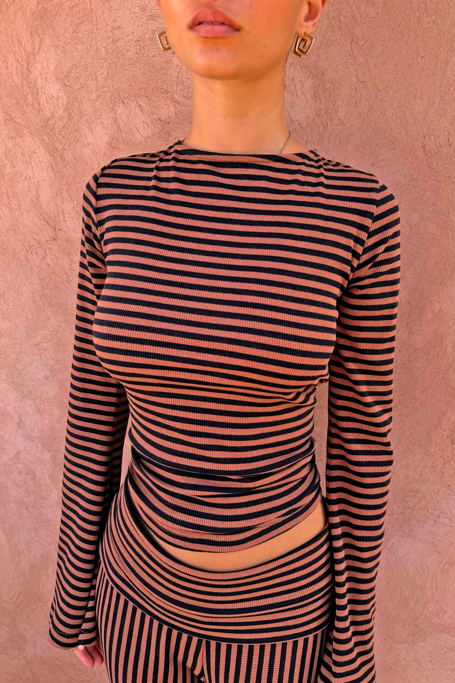 Ribbed Chocolate Stripe Top with a high neck and long sleeves, paired with matching striped trousers.