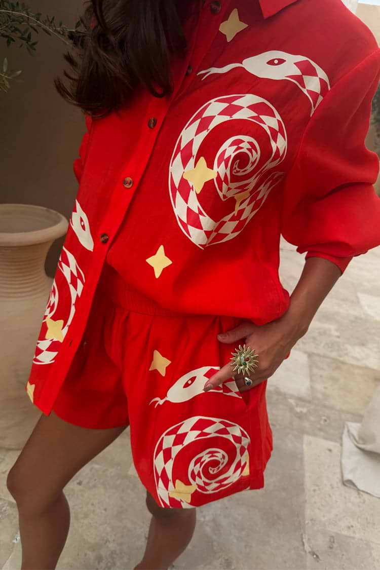 Red Snake Elissa Shorts and Miley shirt co-ord with checkered snake motifs and stars in a bright red tone.