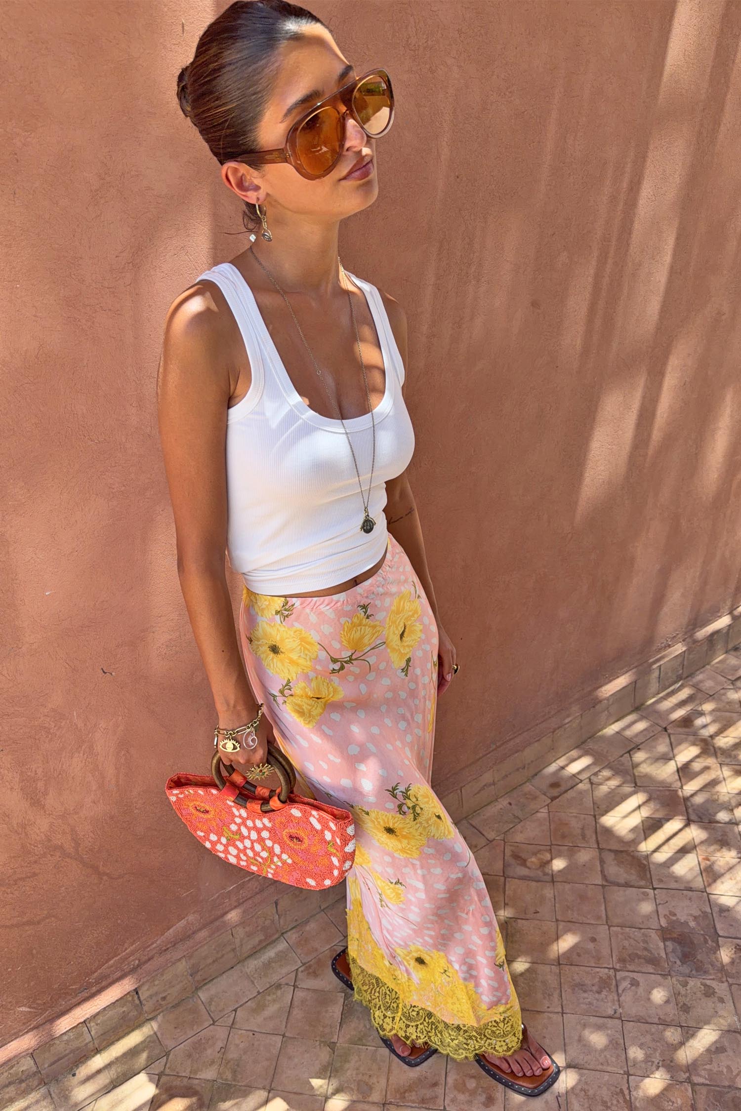 Pink Fawn Poppy Maeva Petite Midi Skirt featuring yellow floral motifs and a contrast lace hem.