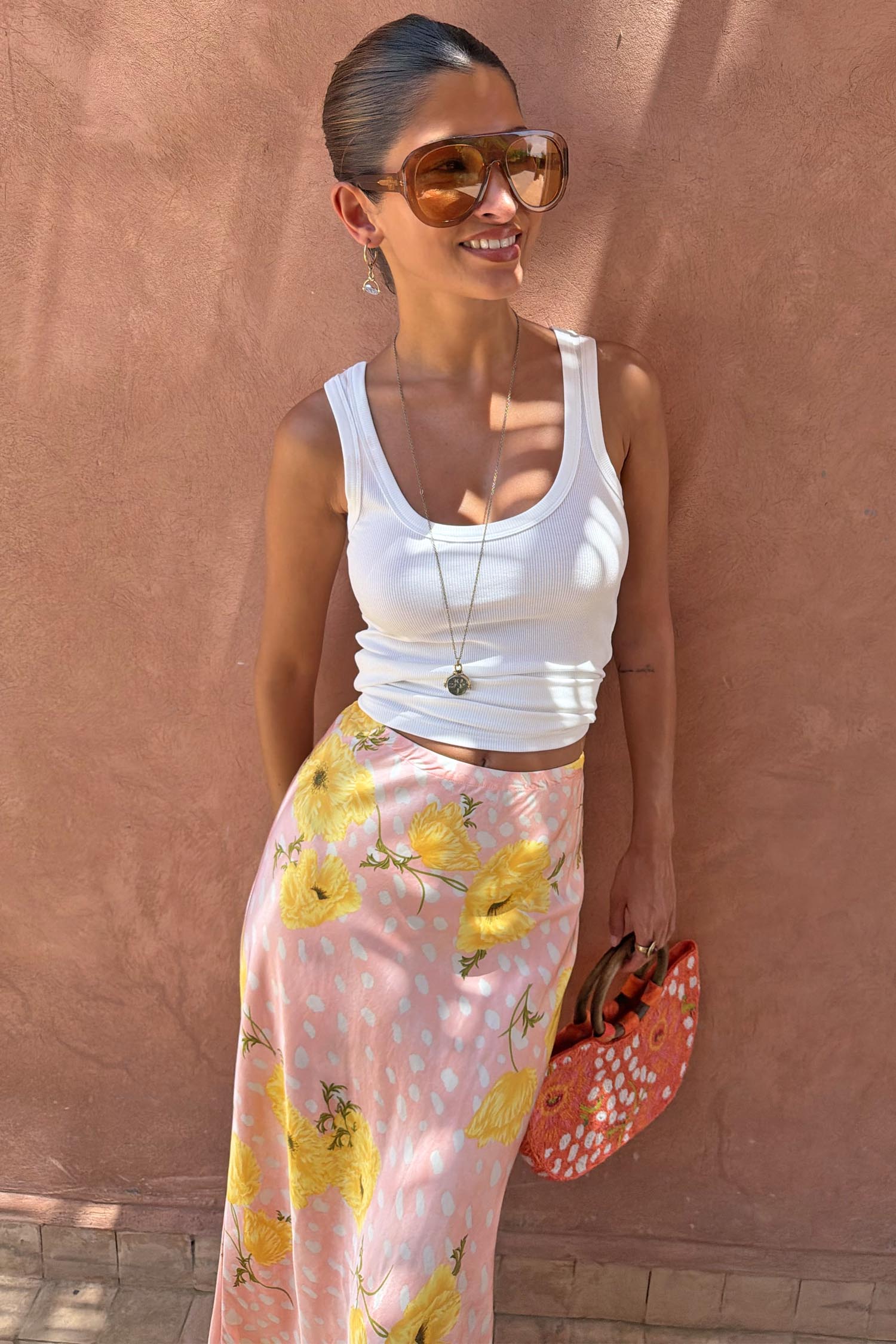 Pink Fawn Poppy Maeva Petite Midi Skirt with yellow poppy motifs and deer print, paired with a white tank.