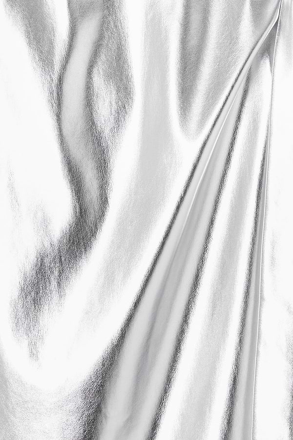 Close-up of metallic silver vegan leather fabric on the iconic Jaspre wrap skirt.