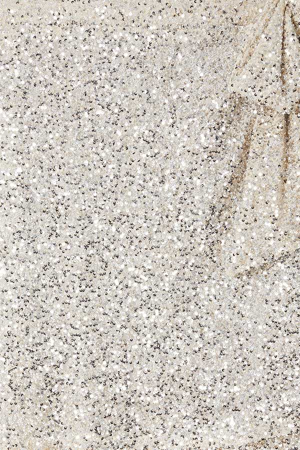 Close-up of silver sequins on the iconic Mini Jaspre wrap skirt.