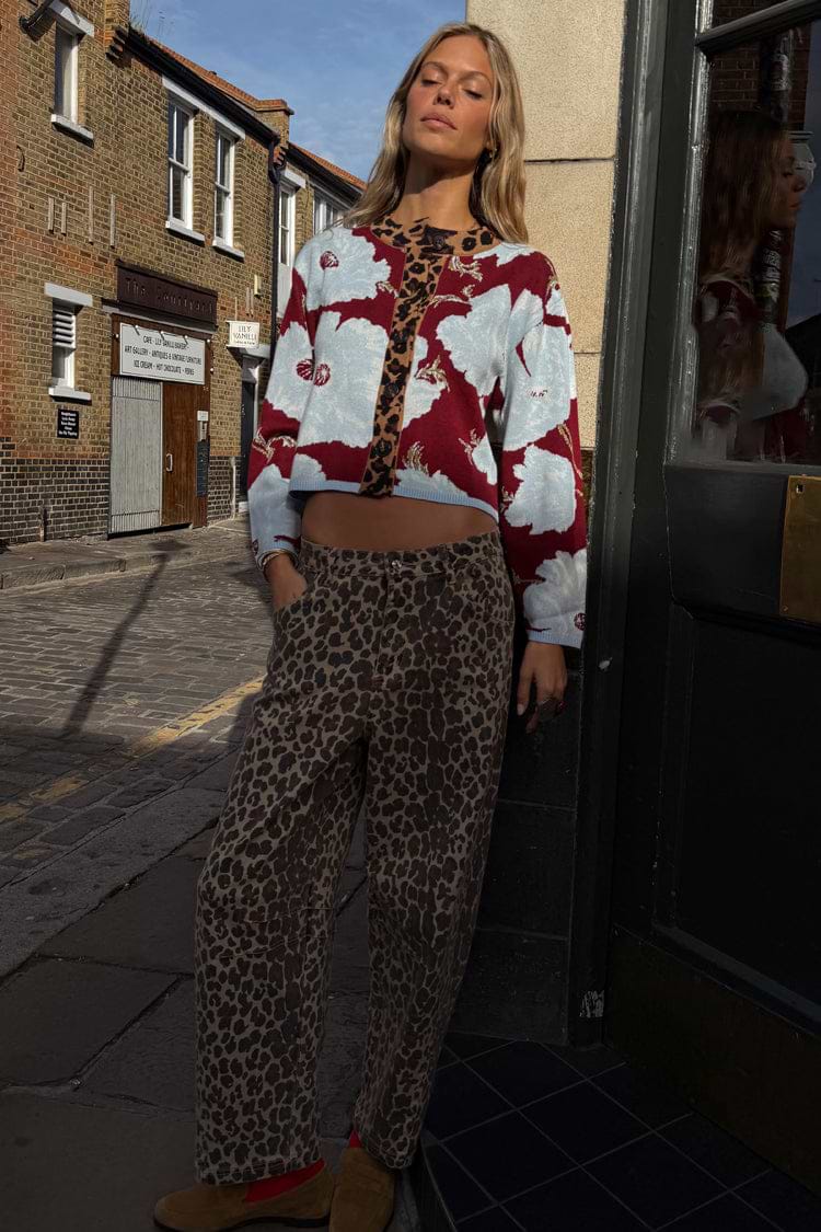 Burgundy & Blue Poppy Cardigan with leopard trim and blue poppy print, styled with leopard trousers for a London look.