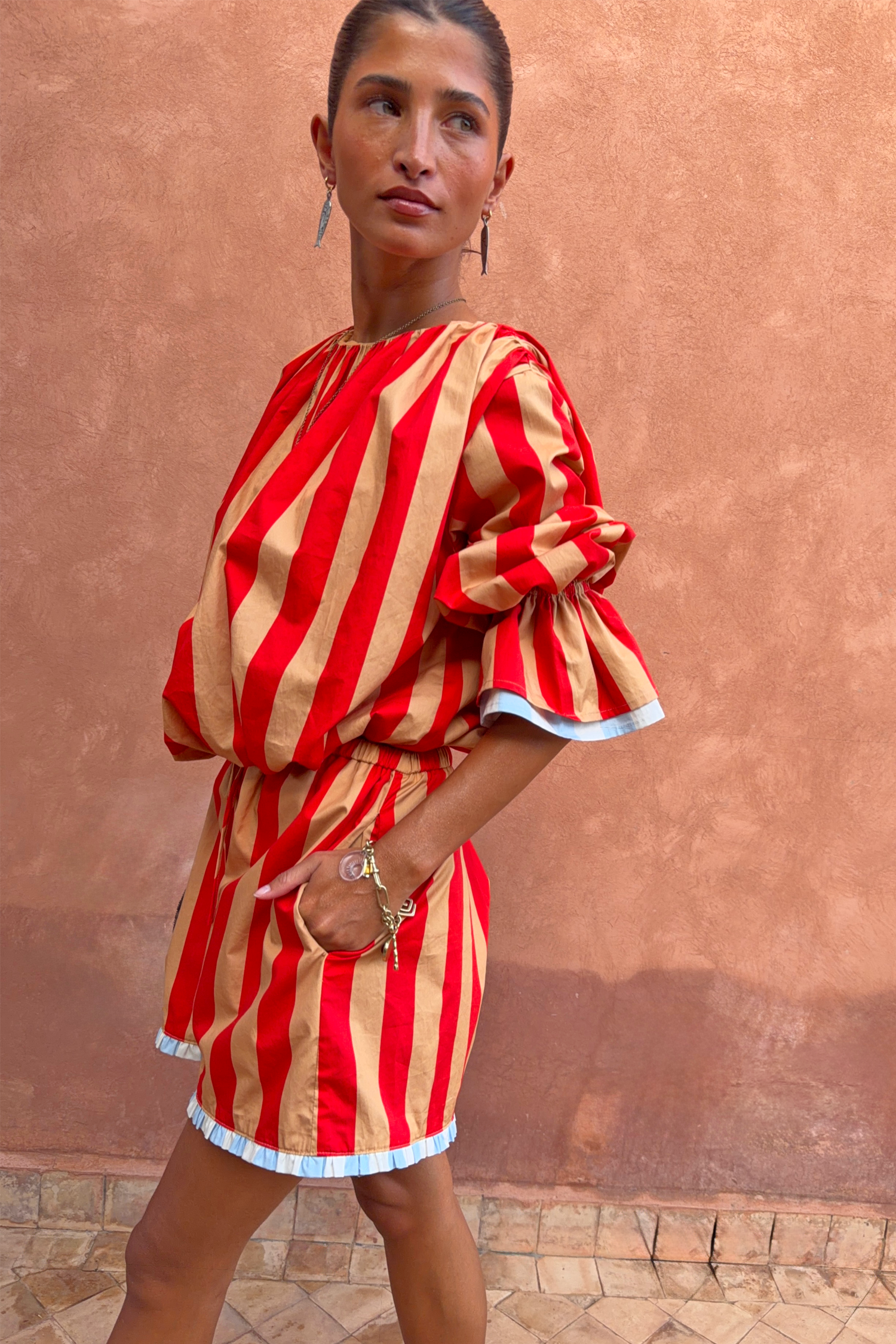 Tomato Stripe Ellie Shorts and matching co-ord blouse in red and camel stripes with blue contrast trims.