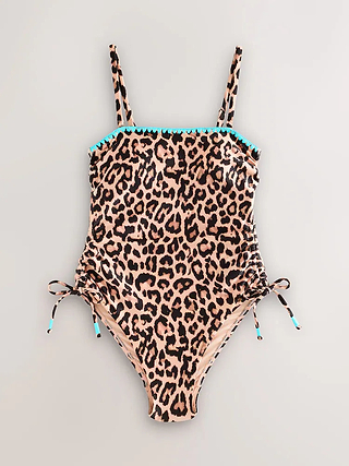 Leopard bandeau swimsuit with blue whipstitch embroidery and ruched side ties, shown in a flat lay.