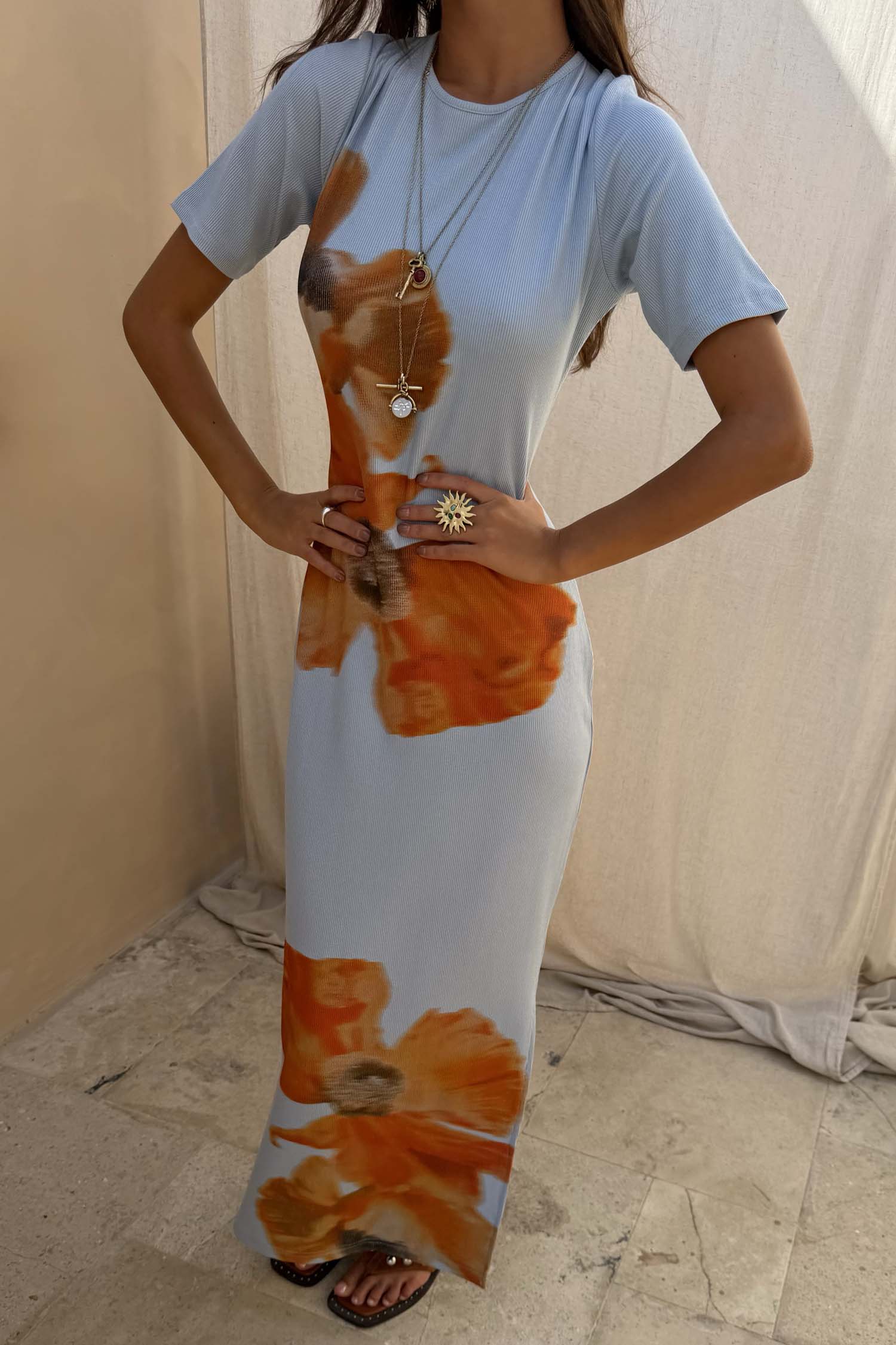 Ice Blue Floral Rib Dress featuring a bold orange floral print and soft stretch ribbed texture in a maxi silhouette.