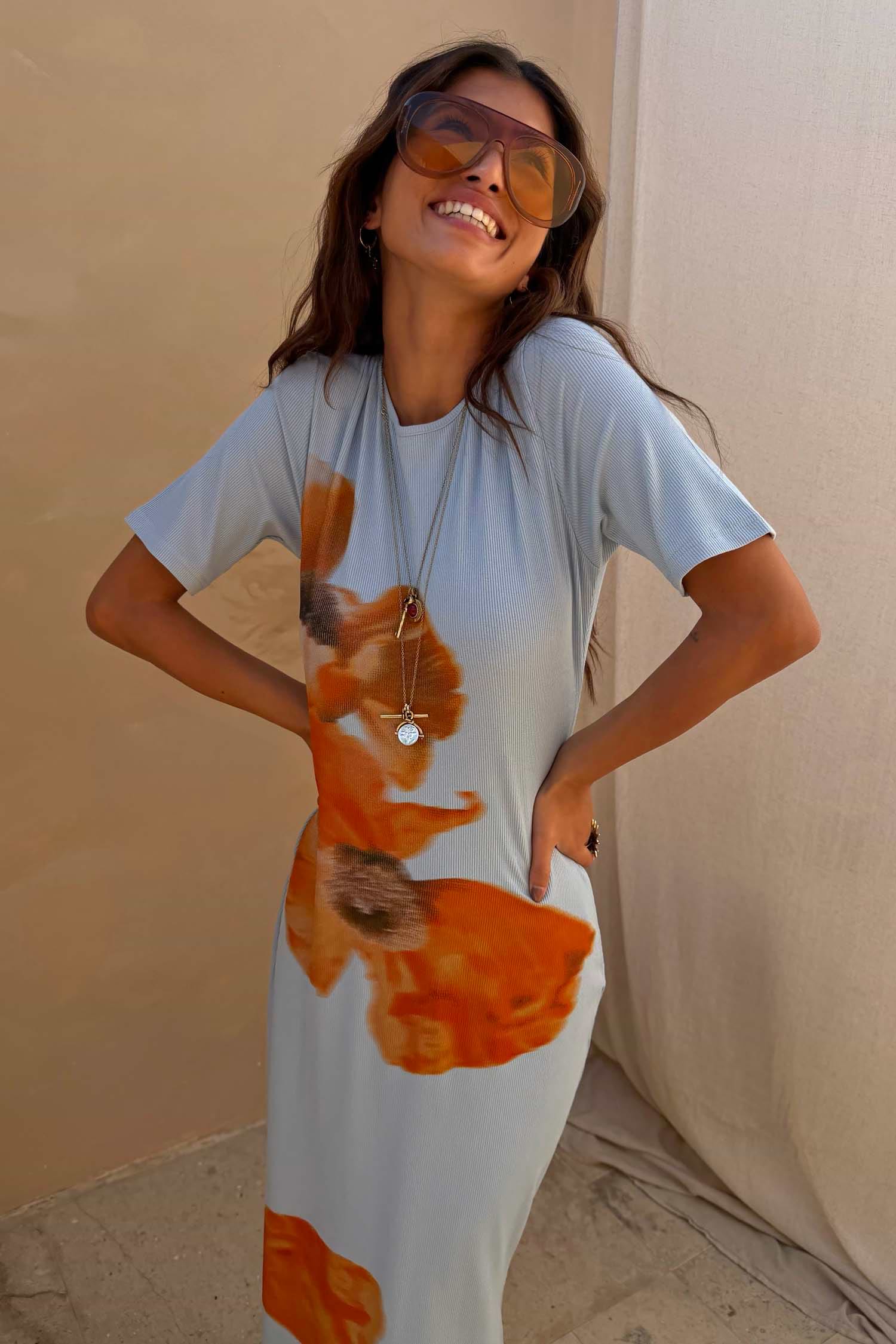Ice Blue Floral Rib Dress featuring a large orange floral print on soft stretch ribbed fabric.