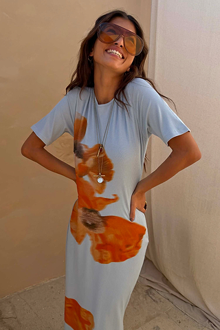 Ice Blue Floral Rib Dress featuring a large orange floral print on soft stretch ribbed fabric.