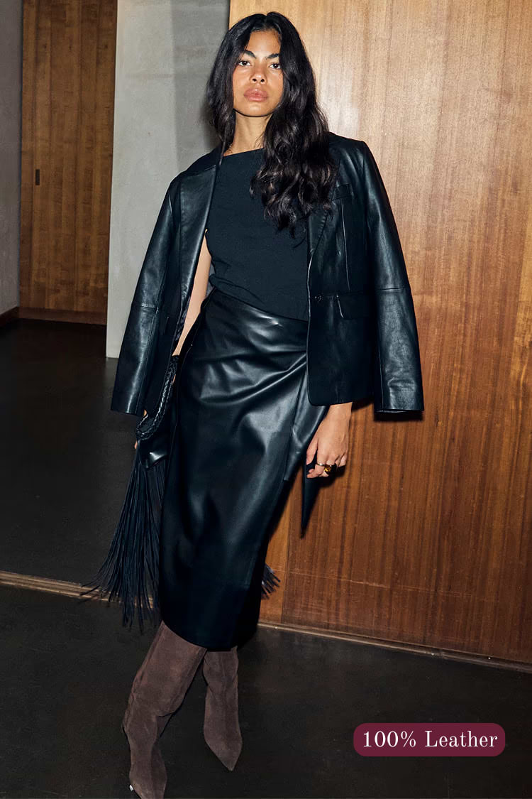Black Leather Blazer with a relaxed silhouette and shoulder pads, crafted from 100% real leather as a transeasonal staple.