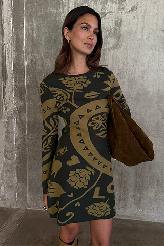 Olive Amara Knit Mini Dress featuring yellow icon motifs, styled with a large brown bag.