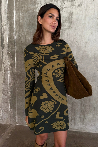 Olive Amara Knit Mini Dress featuring iconic motifs on a soft khaki knit base, paired with a suede bag.