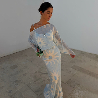 Blue Soleil Anais Dress featuring a Mediterranean soleil sun print, sheer draped top and satin-esque maxi skirt.