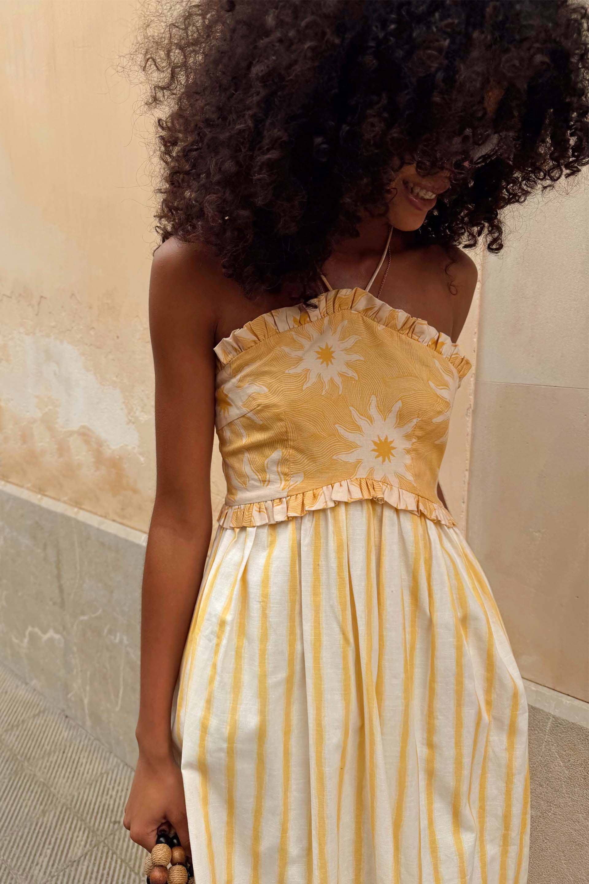 NFD Yellow Stripe Ashley Dress with sun motifs and a ruffled bandeau bodice in a cotton-linen blend.