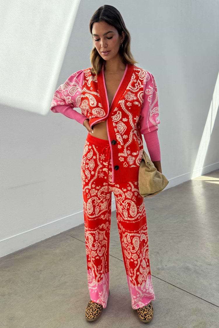 Red Bandana Martha Cardigan with a red and pink bandana print, worn as a co-ord with matching knit trousers.