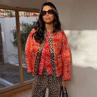 Red Bandana Reversible Jacket in quilted fabric with leopard trim, styled with leopard print trousers.