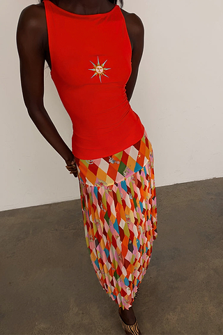 Cirque Beatrice Skirt featuring a multi-coloured geometric diamond print, cirque motifs and a pleated A-line hem.