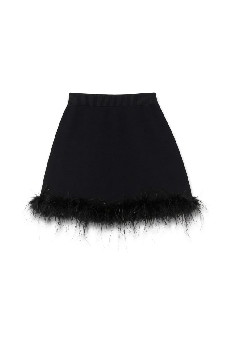Black Jake knit mini skirt featuring a thick elasticated waistband and detachable feather trim along the hemline.