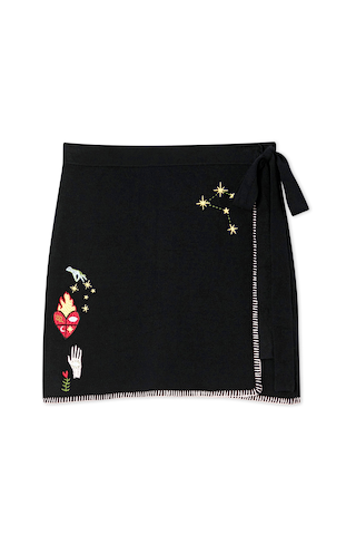 Black Night Garden Mini Wrap Skirt in soft knit with celestial motifs, contrast pink blanket stitching and side wrap tie.