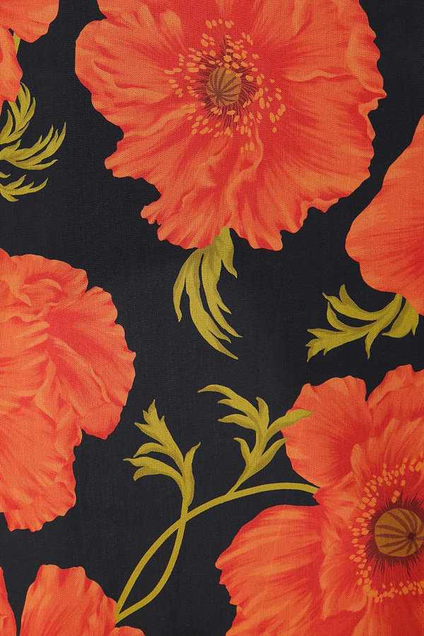 Black Poppy Aria Mesh Dress detail featuring red poppy blooms and green leaves on a black sheer base.