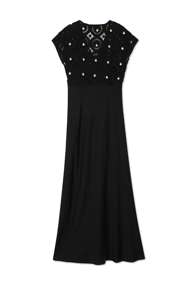 Black Elodie Dress featuring a crochet bodice with gold shell embellishments and a flowing, sleek skirt.