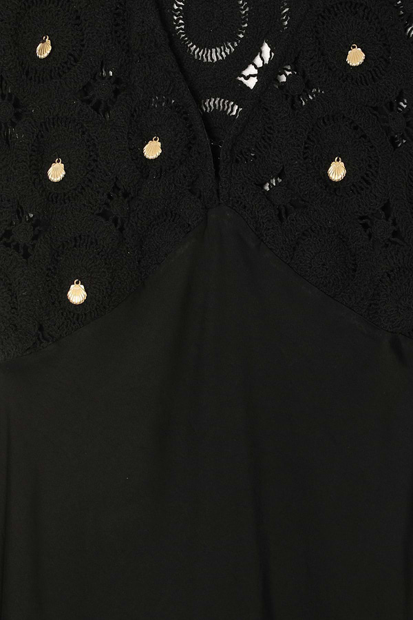 Black Crochet Shell Elodie Dress detail featuring gold shell charms on a crochet bodice and satin fabric.