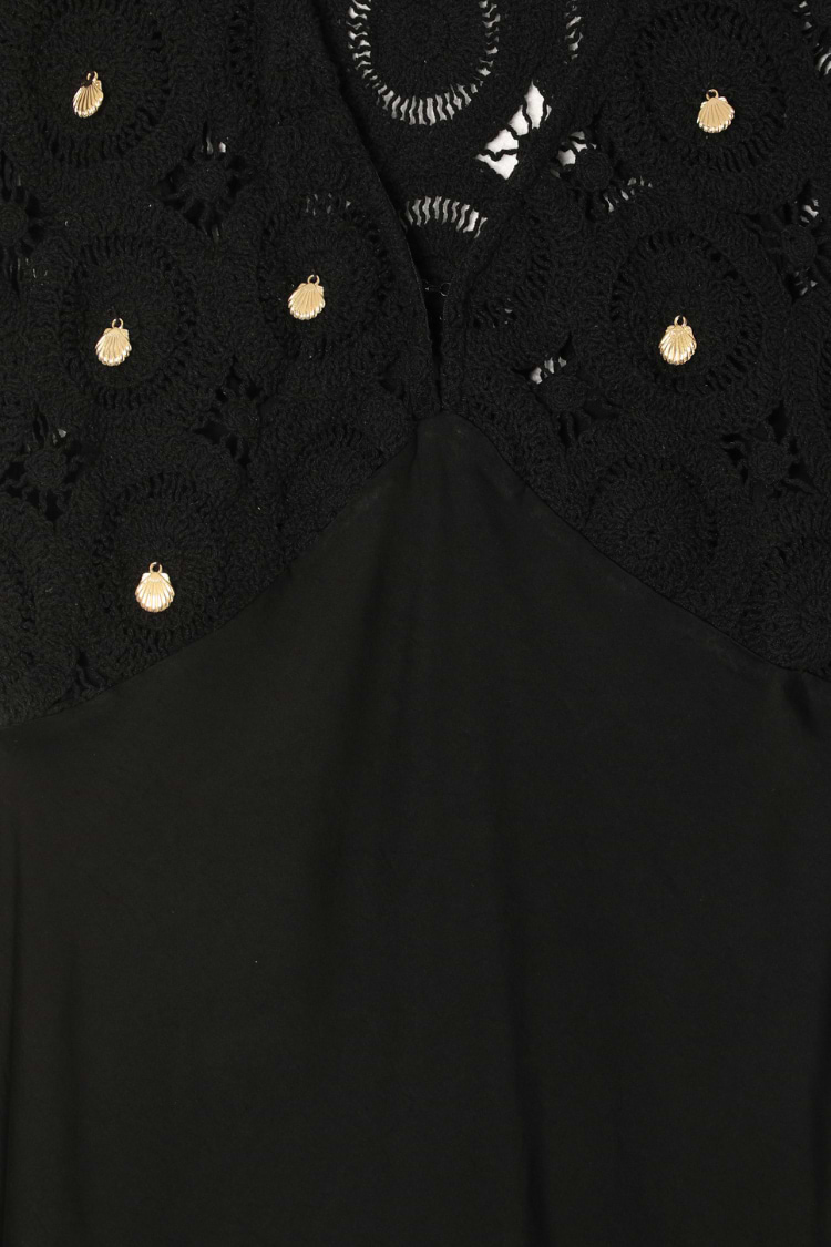Black Crochet Shell Elodie Dress detail featuring gold shell charms on a crochet bodice and satin fabric.