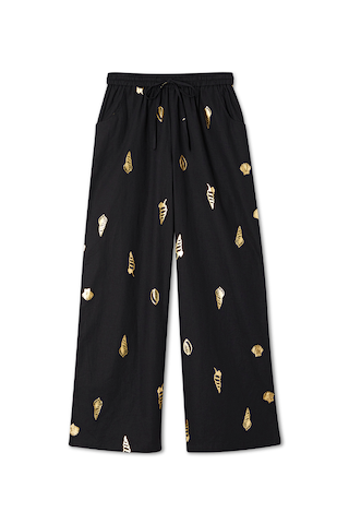 Black Shell Elissa Trousers with a gold metallic shell print, wide-leg silhouette and elasticated drawstring waist.