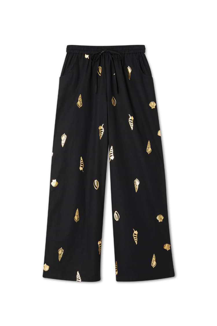 Black Shell Elissa Trousers with a gold metallic shell print, wide-leg silhouette and elasticated drawstring waist.
