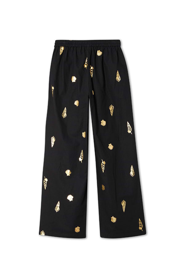 Black Shell Elissa Trousers featuring a gold shell print, wide-leg fit and elasticated waist.