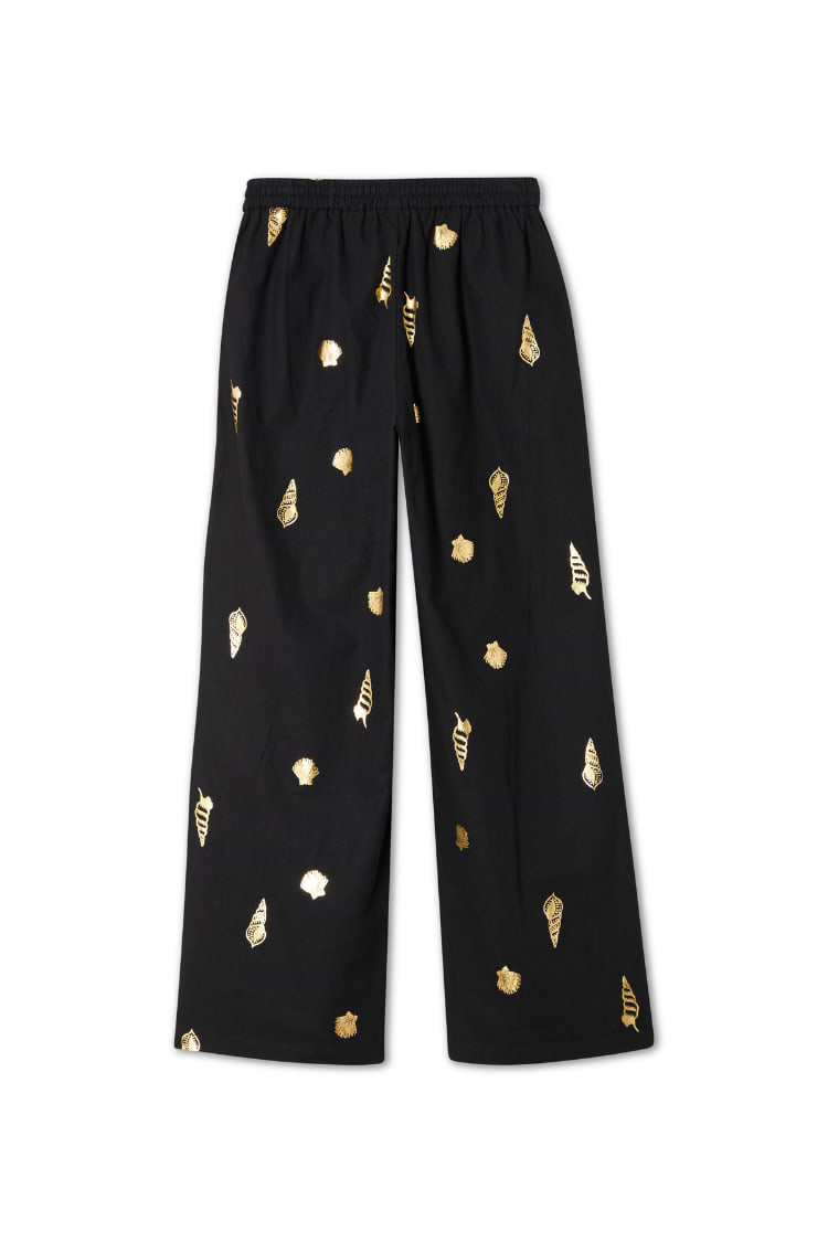 Black Shell Elissa Trousers featuring a gold shell print, wide-leg fit and elasticated waist.
