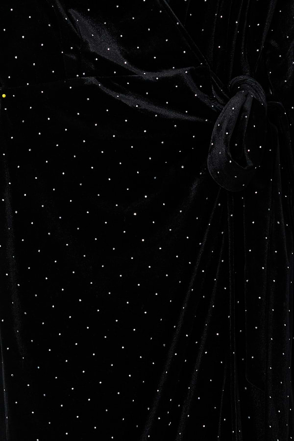 Black Velvet Midi Vienna Dress detail featuring a wrap tie fastening and shimmering silver pin-dot pattern.