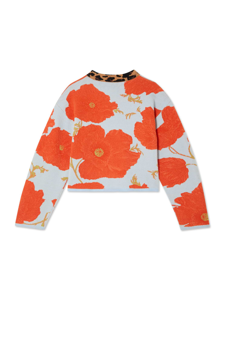 Blue Poppy Cardigan in pale blue knit with a large orange poppy print and contrast leopard print collar.