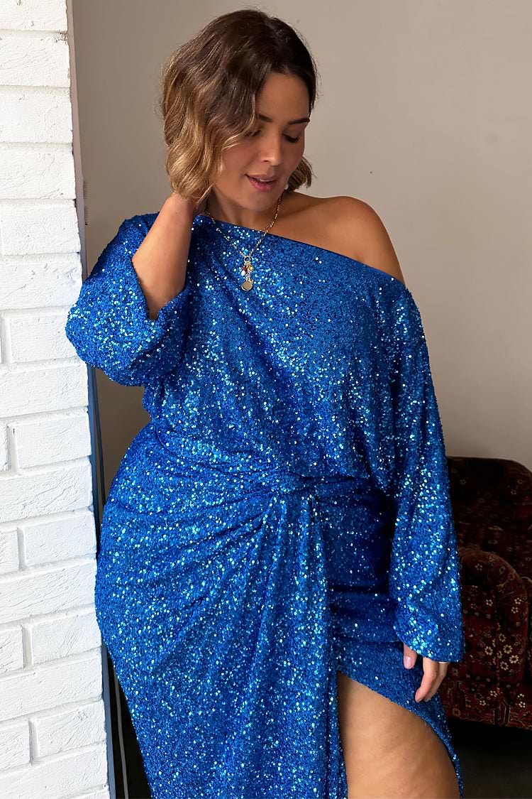 Blue Sequin Tilly Top styled off the shoulder with a matching skirt, showcasing inclusive curve fashion.