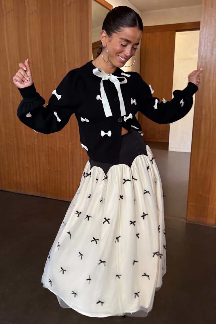 Black Bow Sophie Cardigan with cream 3D bows and tie neck fastening, styled with a matching bow tulle skirt.
