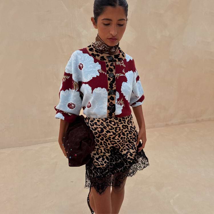 Burgundy & Blue Poppy Cardigan with leopard print trim and poppy motifs, paired with a lace-trimmed leopard skirt.
