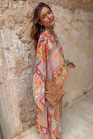 Dolce Vita Cape Top in a pastel tile patchwork print with wide fluid sleeves and a detachable matching scarf.