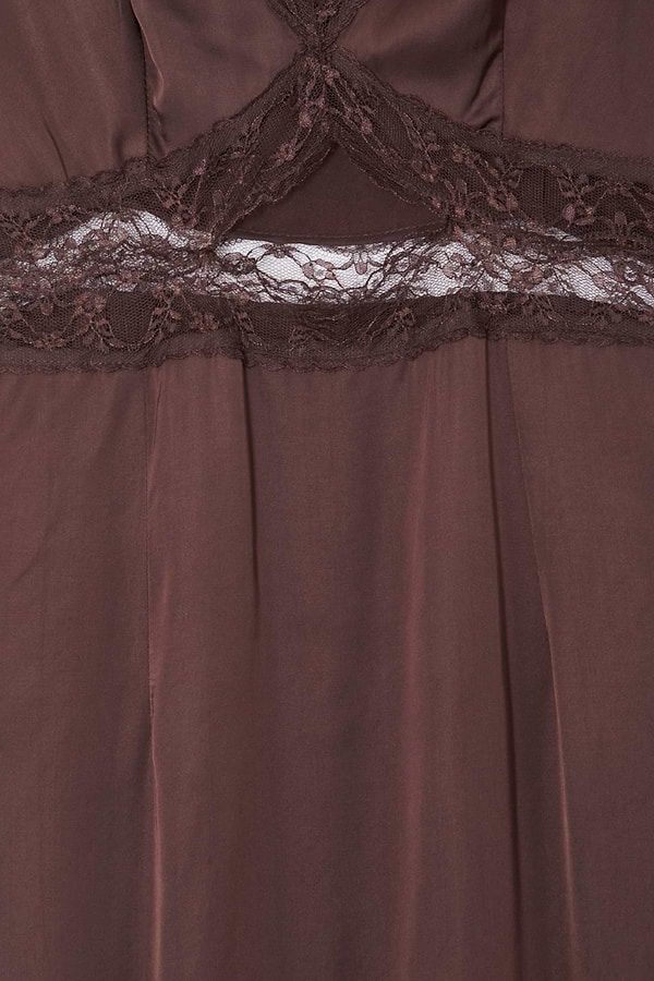 Chocolate Mimi Dress detail highlighting the intricate brown lace trim and under-bust cutout design.