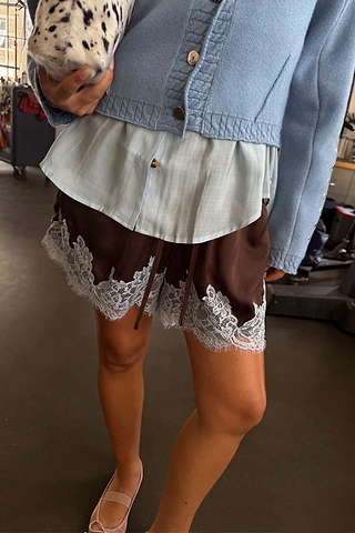 Chocolate and Blue Lace Shorts in brown satin with blue lace trim, styled with a blue knit cardigan and shirt.