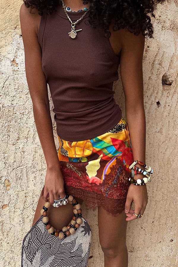 Chocolate Ribbed Tank in stretch fabric, styled with a colourful printed lace mini skirt and beaded bag.