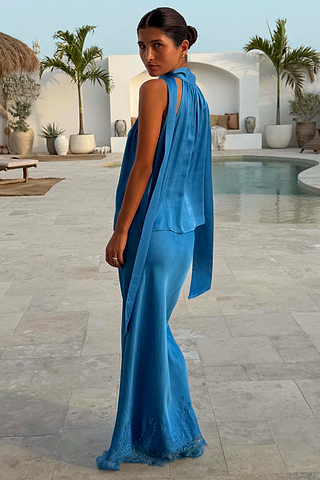 Cobalt Maeva Midi Skirt with a lace hem and matching top, styled as a co-ord in a poolside vacation setting.