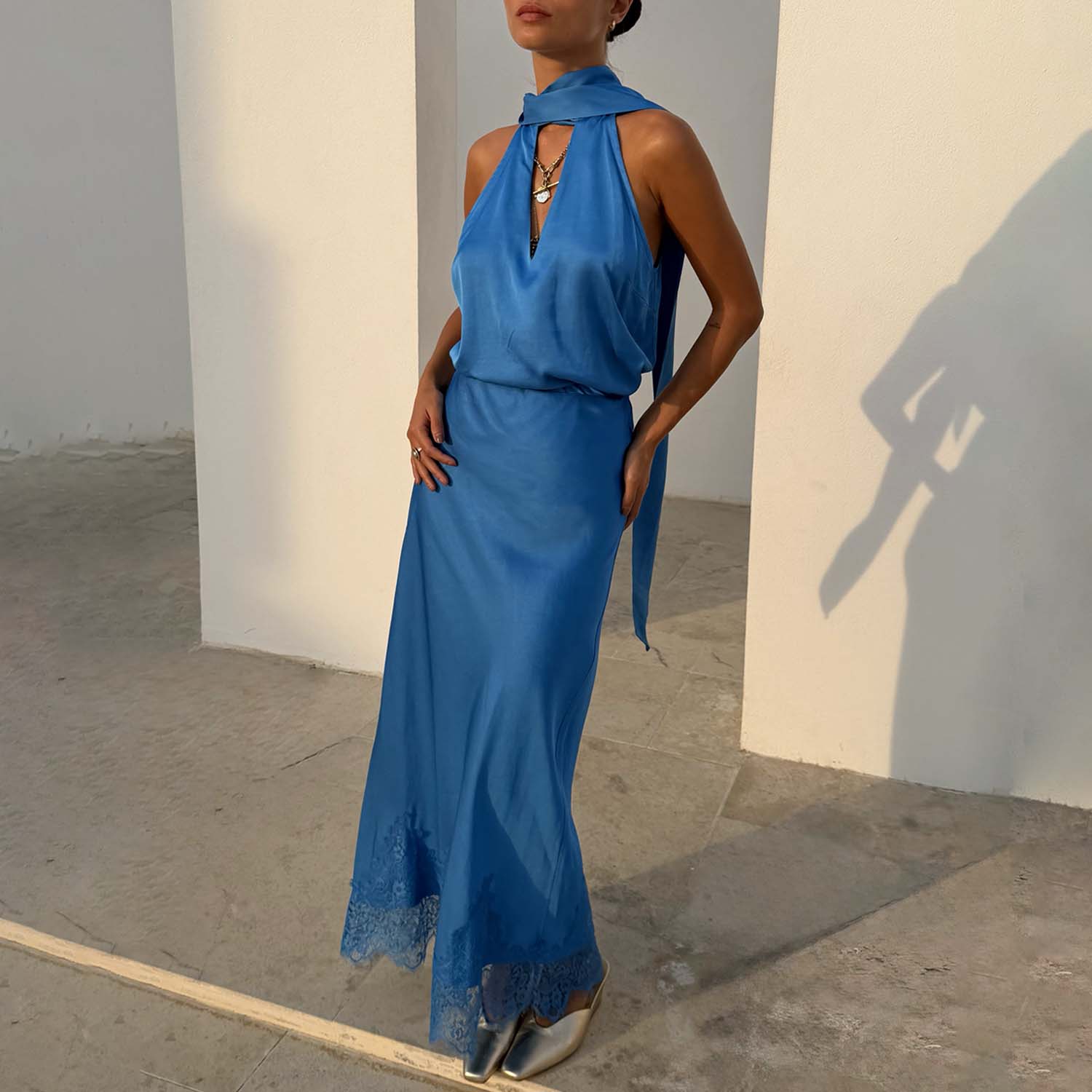 Cobalt Maeva Midi Skirt in blue with a lace-trimmed hem, worn as a co-ord with a matching halter-neck top.