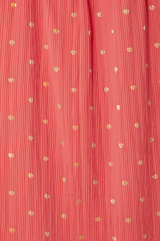 Coral Tilly Dress detail highlighting the textured plisse fabric and shimmering gold flecks.