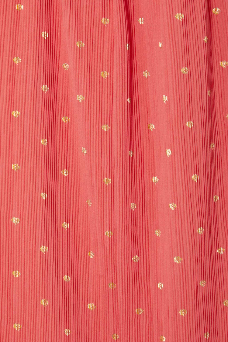 Coral Tilly Dress detail highlighting the textured plisse fabric and shimmering gold flecks.