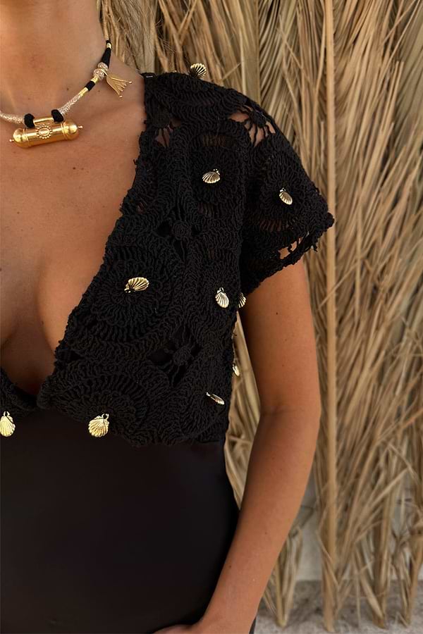 Black Crochet Shell Elodie Dress bodice with intricate knit and gold shell embellishments, designed in London.