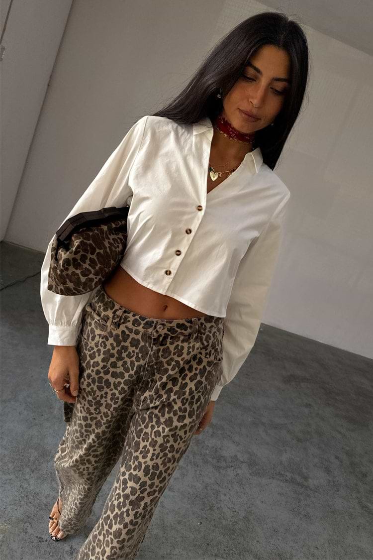 White Cropped Cotton Miley Shirt with tortoise buttons and blouson sleeves, styled with leopard print trousers.