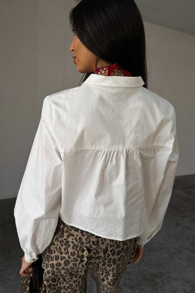 White Cropped Cotton Miley Shirt featuring an embroidered back neck logo and slight blouson sleeves.