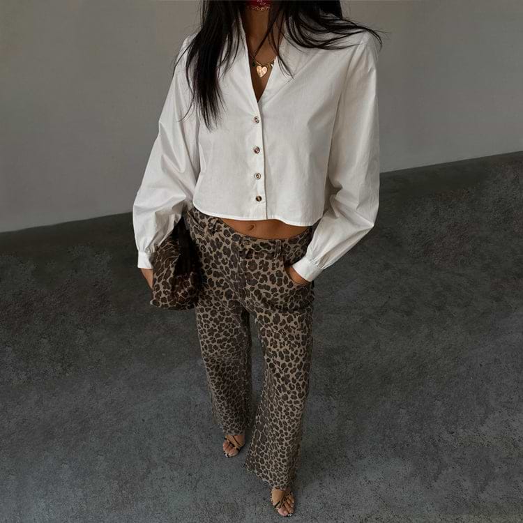 White Cropped Cotton Miley Shirt with tortoise buttons and blouson sleeves, styled with leopard print trousers.