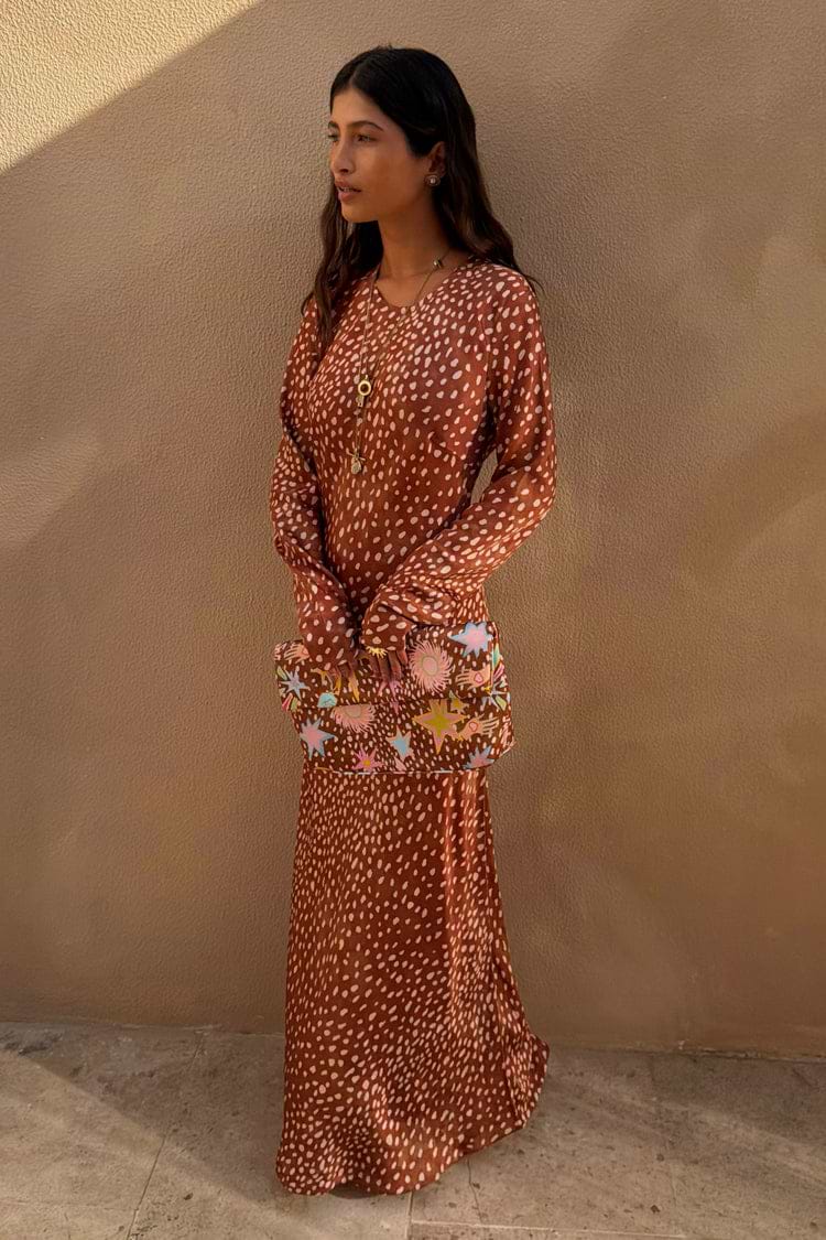 Iconic Fawn Soho Dress in a blush and cream deer print with long flared sleeves and a satin-esque finish.