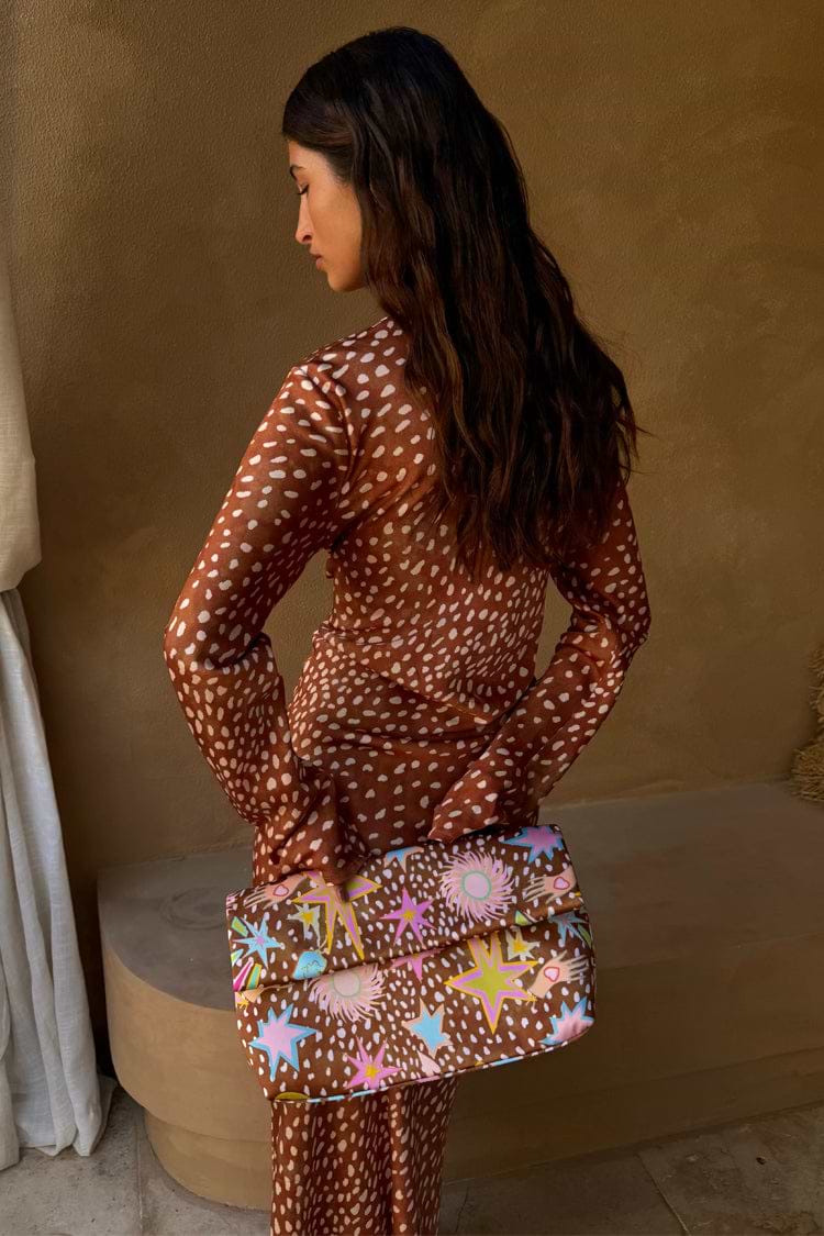 Fawn Soho Dress in brown satin with a spotted deer print and flared sleeves, shown from the back.