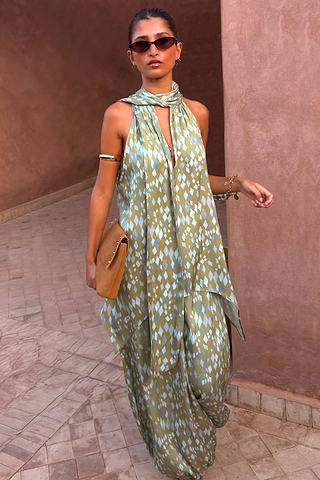Green Diamond Print Halter Top in olive satin with a draped scarf and asymmetric hem, styled with matching trousers.